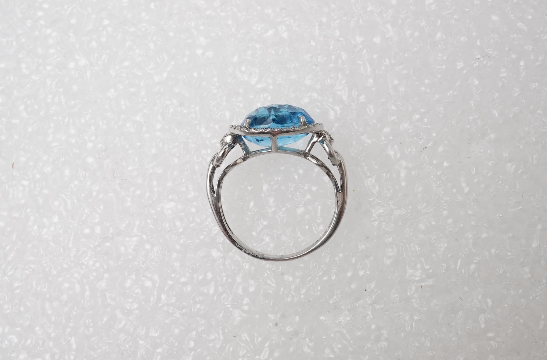 A blue topaz and diamond ring